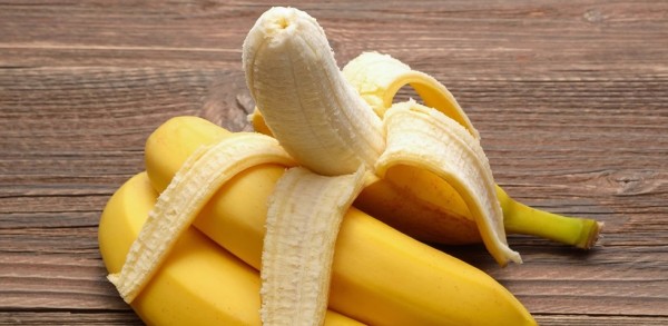 43851812 - fresh bananas on wooden background